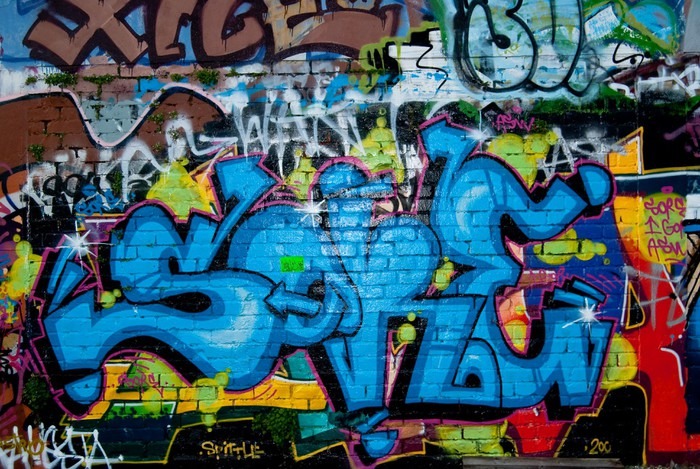 Fotomural Graffiti detalle en la pared de ladrillo con textura • Pixers